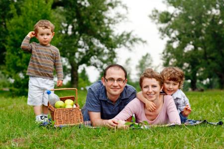 portrait of happy family having a picnic