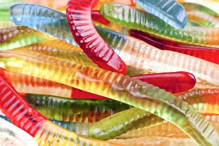 Colourful gummy jelly worm candies.