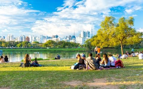 People enjoying a hot day in Ibirapuera Park. Ibirapuera Park is the largest park in Sao Paulo, Brazil.
