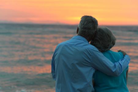 Couple looking at sunset.