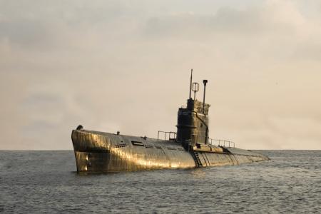 Submarine emerging from the ocean.