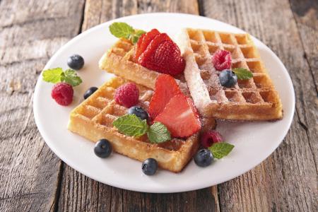 Waffles with strawberries and blueberries.