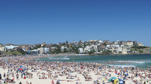 A zoomed out view of a crowded Bondi Beach on a hot New Year's day in Sydney, Australia.