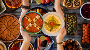A table full of colorful Middle Eastern food pictured from above.