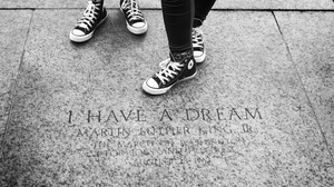 Sneakers standing next to the engraved pavement in the location of where Martin Luther King made his famous 