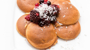 Pancakes with berries and coconut flakes