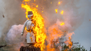 Snowman figure burned on a big bonfire.