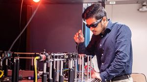 Space Communications and Navigation intern, Ashwin Mishra, testing equipment in the Quantum Communications Lab at NASA’s Glenn Research Center.