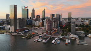  Aerial photo showing Perth (Elizabeth Quay) at sunset with an urban scene of scyscrapers, metal, and glass, reflecting in the waters below.