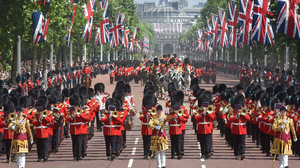 Guards and military bands marching up the Mall in London.