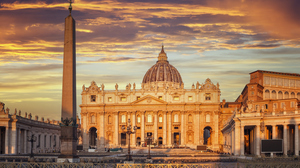 St. Peter's Basilica in front of a beautiful sunrise, Vatican City, Rome, Italy.