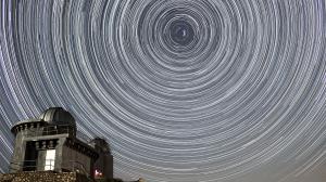 Star trails over an observatory.