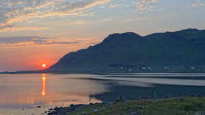Sun rising in Lofoten, Nordland on summer solstice in june.