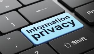 Information privacy button on computer keyboard.
