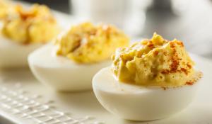 Healthy deviled eggs on a white platter.