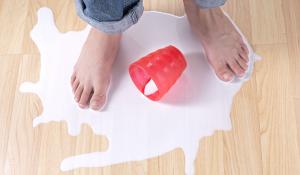 Person standing in a puddle of spilled milk.