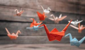 Colorful origami cranes hanging from the roof.