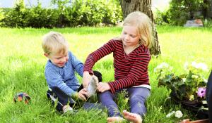 Kids putting on shoes.