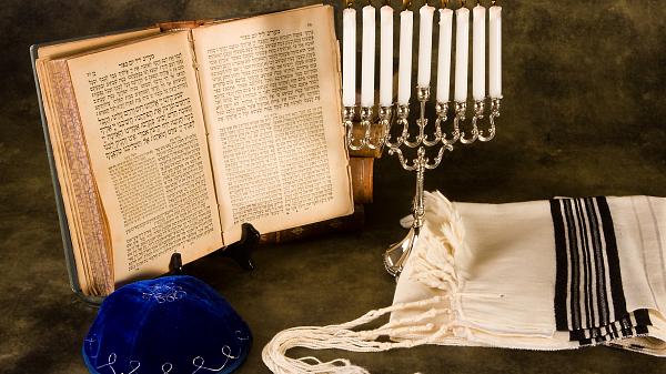 Jewish prayer shawl, cap and nine candle menorah