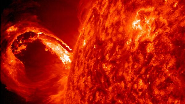 An image of a coronal mass ejection erupting from the Sun.