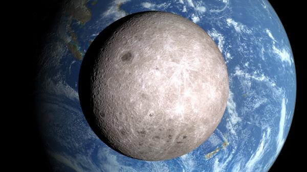 Close-up of the far side of the Moon with partial Earth in the background.