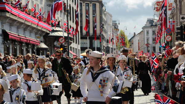 Marching band parading in Oslo on Norway's Constitution Day.