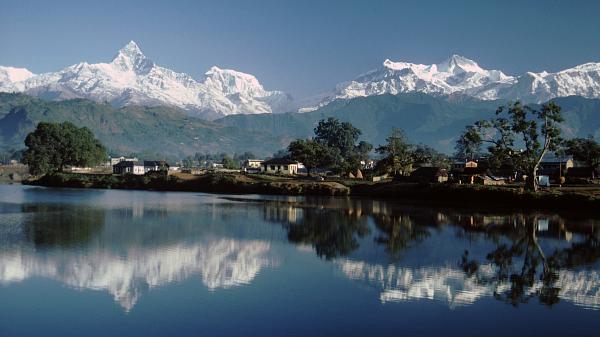 View of Machapuchare (Fishtail mountain) and the Himalaya from Damside at Pokhara, Nepal