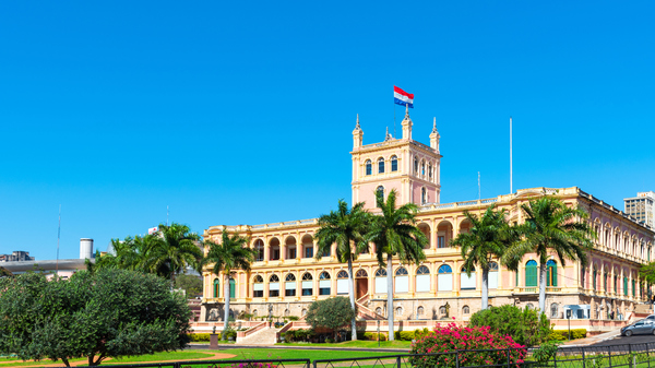 Historic building with the Paraguayan flag flying on top.