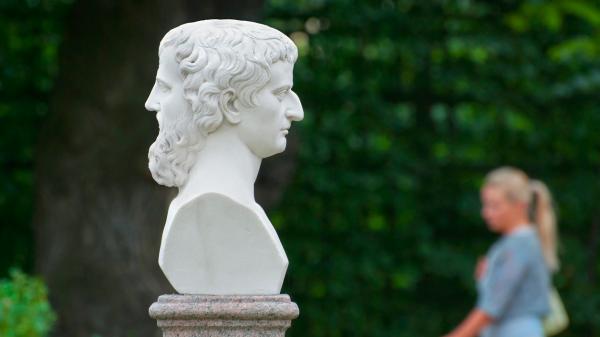 White bust of the two-faced Roman god, Janus, in the Summer Garden in Saint - Petersburg, Russia, founded by Peter the Great.