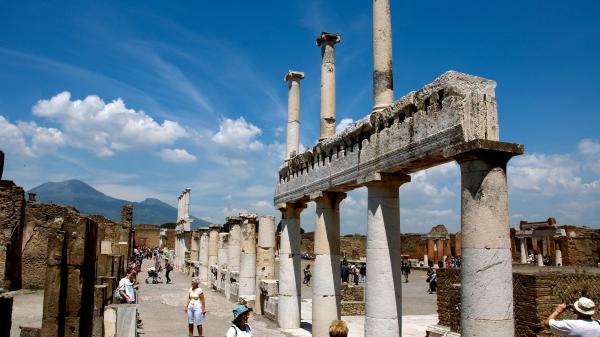 Tourists visit the ruins of the ancient city of Pompeii, Italy.