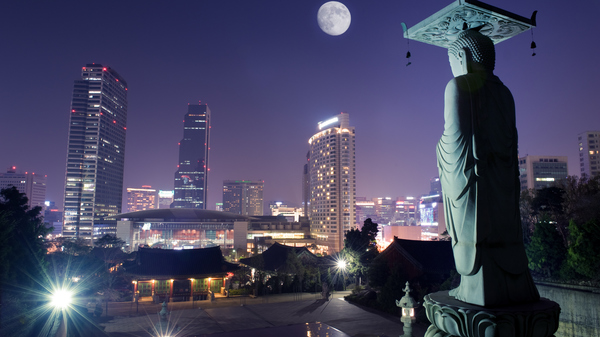 Night view of Seoul and Bongeunsa temple in Korea, showing a Full Moon over the South Korean capital city.