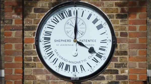 The Shepherd Gate Clock on the wall at the Royal Observatory Greenwich.