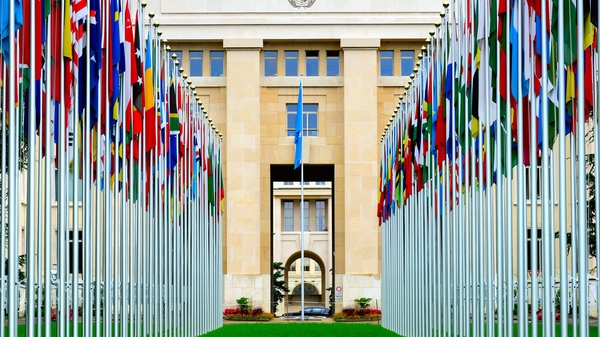 Flags from all over the world lining up the way to the United Nations's headquarters in Geneva, Switzerland.