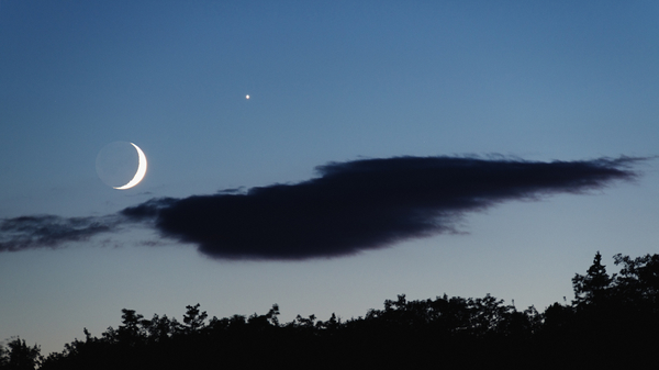 Venus hangs next to a Waxing Crescent Moon in the evening sky