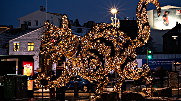 Light installation showing the Yule Cat in Reykjavik, Iceland at night in winter.