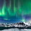 The aurora borealis over mountains in Harstad, northern Norway.