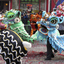 Chinese lions dance to the firecrackers in Chinatown of Washington D.C. for the annual Chinese New Year celebration.