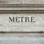 The standard meter engraved in stone on the left of the entrance of the French Ministère de la Justice in Paris, France.