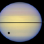 Saturn's rings seen edge-on by the Hubble Space Telescope. The large spot is the shadow of Saturn's moon Titan.