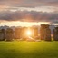 The Sun shining through the Stonehenge ancient monument.