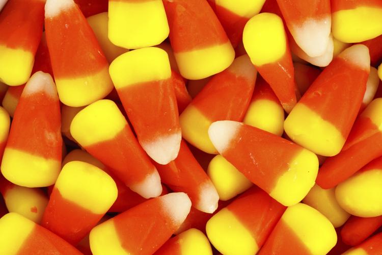 Closeup pile of colorful Halloween candy corn.