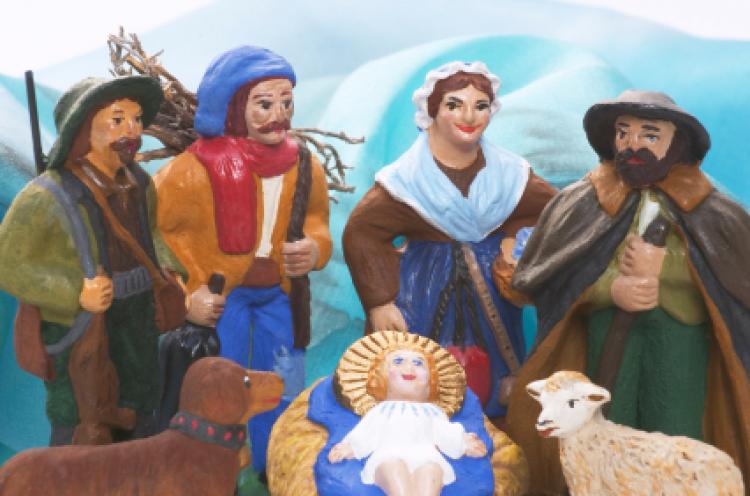 "Santons"visit the new-born child Jesus.