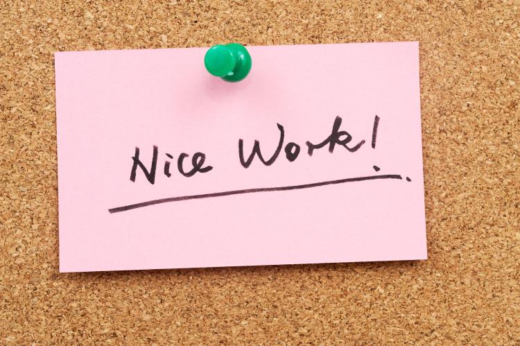 Post it note with "Nice work!" written on it.