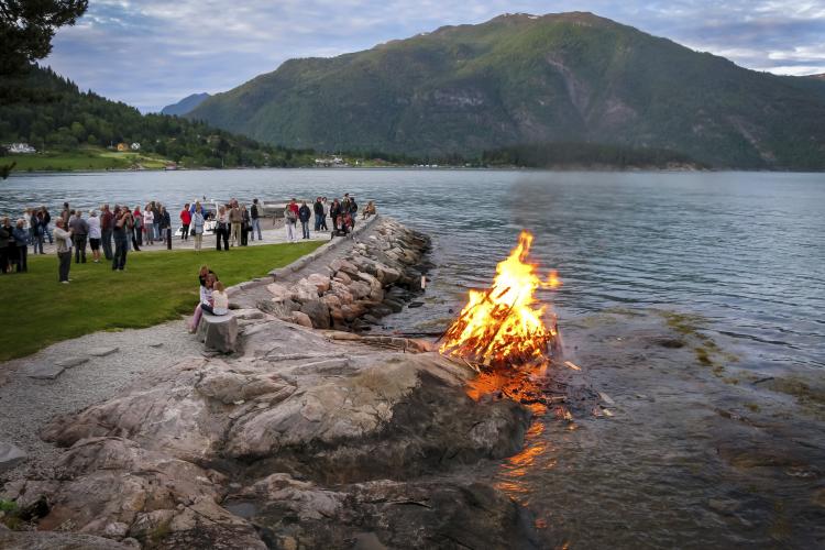Bonfire by the water on Midsummer Eve in Balestrand, Sognefjord.