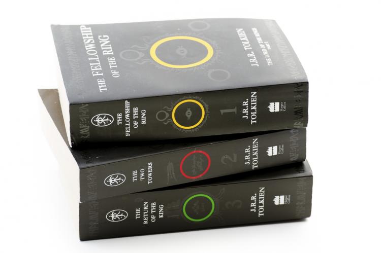 The epic fantasy trilogy written by J.R.R. Tolkien, The Lord of the Rings, includes The Fellowship of the Ring, The Two Towers, and The Return of the King.