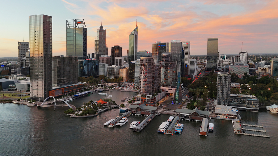  Aerial photo showing Perth (Elizabeth Quay) at sunset with an urban scene of scyscrapers, metal, and glass, reflecting in the waters below.
